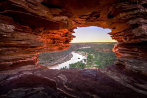Scenic view through Nature’s Window rock formation in Kalbarri National Park, looking out over the winding Murchison River and green gorge below.